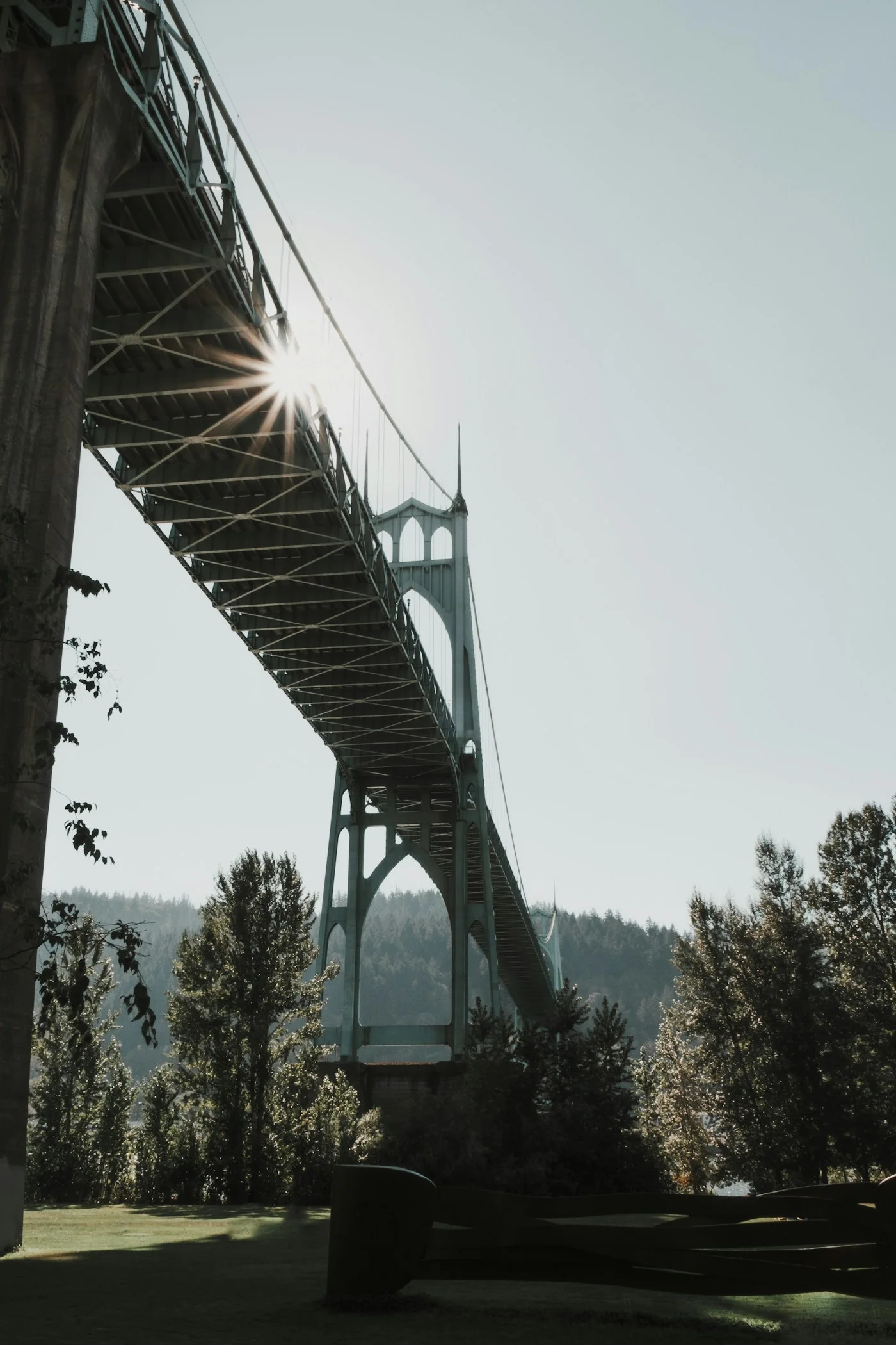 The green towers and steel cables of St. Johns Bridge in Portland, Oregon